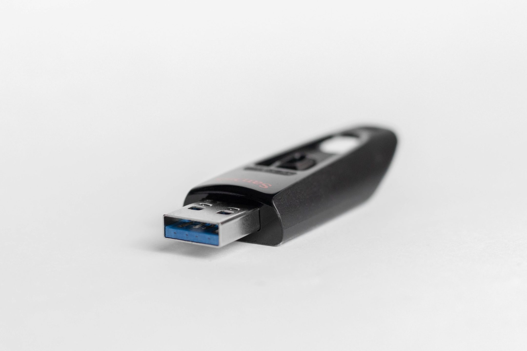 Black USB thumb drive on a white background